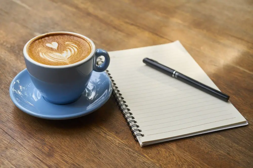 Coffee Cup And A Notebook